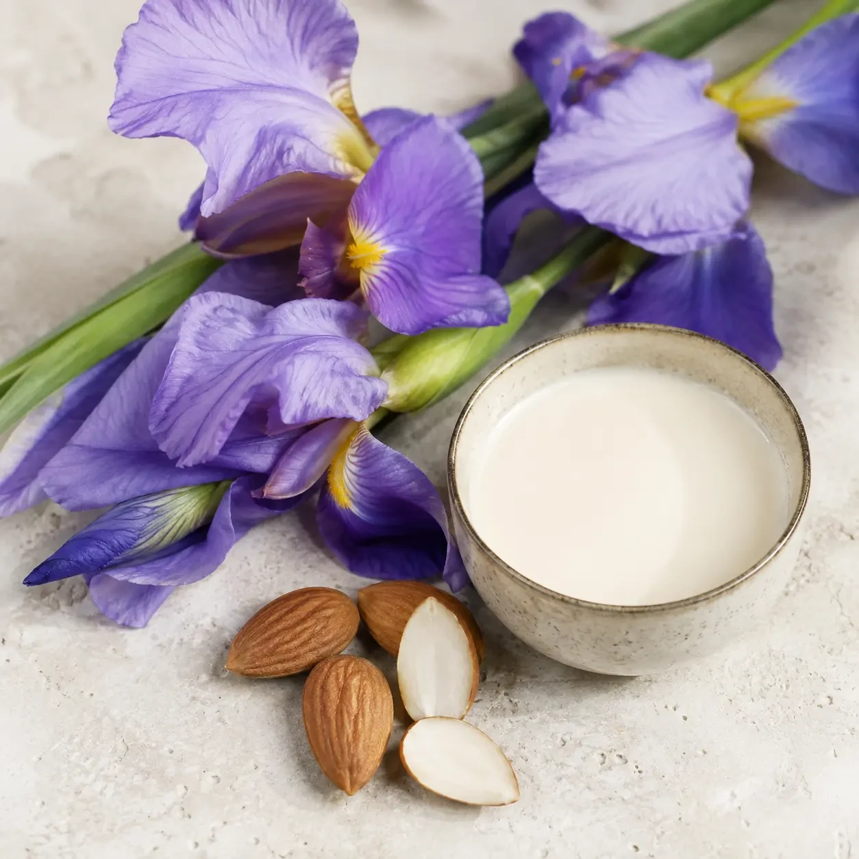 Atmospheric interpretation of iris opens powdery and cool, with almond milk keeping it soft rather than sharp.