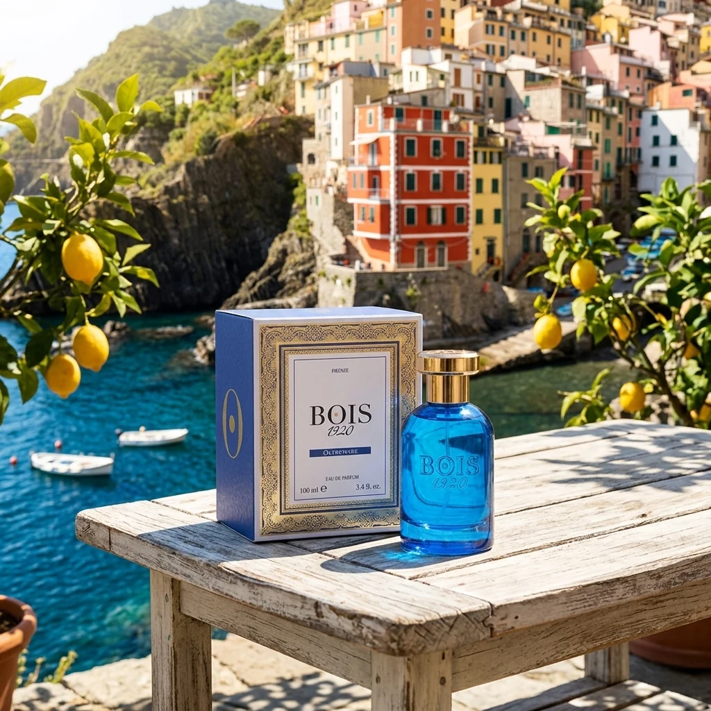 Bois 1920 Oltremare bottle and box on a wooden table above a Ligurian coastal village, lemon trees framing the view